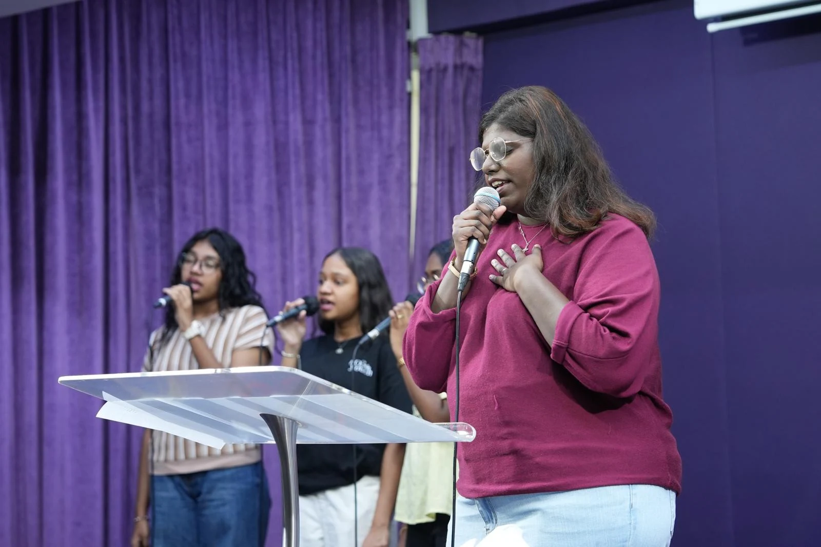 Singers sharing a song at a YC gathering